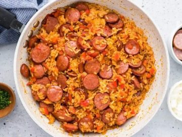 This super quick and easy recipe is simply a one-pot sausage and rice dish that’s packed with savory, smoky sausage flavor, tender diced peppers, and flavorful tomato rice.
