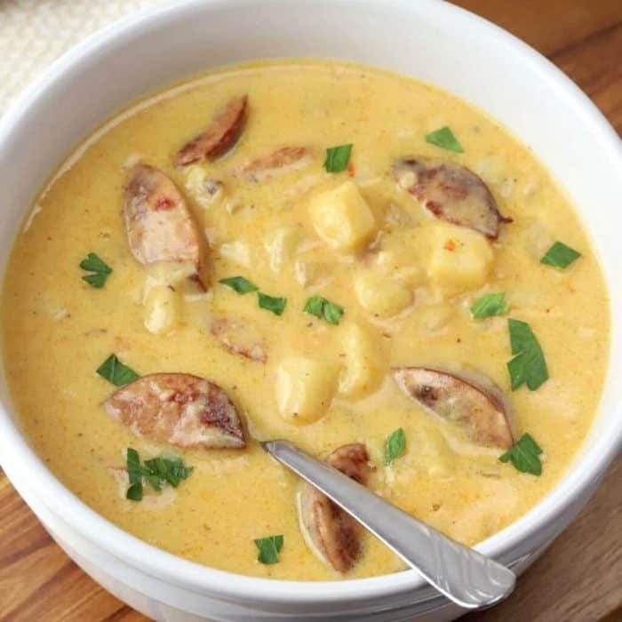Kielbasa potato soup is a comforting and hearty dish featuring sausage, potatoes, and shredded cheddar cheese.