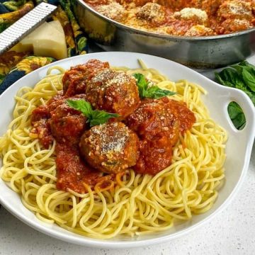 this spaghetti and meatballs recipe — a classic comfort dish that's been elevated with fresh herbs and a blend of beef and pork for the ultimate flavor.