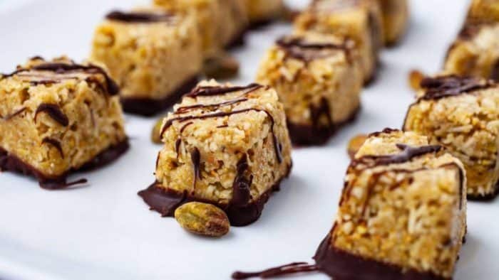 coconut bites has the crunch of desiccated coconuts and pistachios and the depth and sweetness of dark chocolate