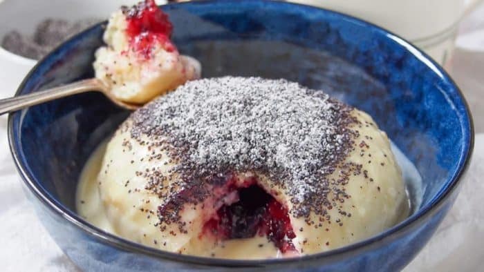 An Austrian delicacy, germknödel is a yeast dumpling filled with spiced plum jam and topped with poppy seeds and a blanket of vanilla sauce. 