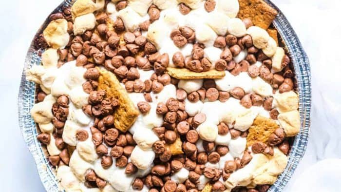 Graham crackers, marshmallows, and chocolate chips meld together in the heat, creating a gooey, melty dessert