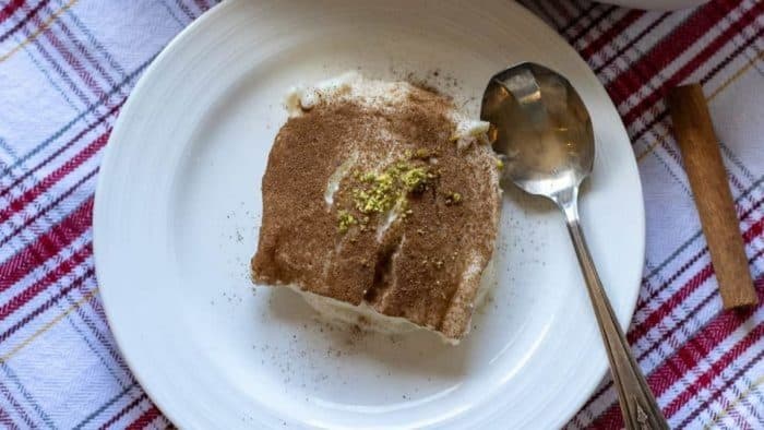 This classic Turkish dessert uniquely incorporates finely shredded chicken breast into a creamy milk pudding made with rice flour and sugar, creating a fusion of savory and sweet. 