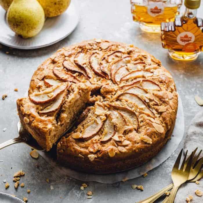 Ripe pears are nestled into spiced cake batter in this recipe, creating pockets of juicy fruit in every slice.