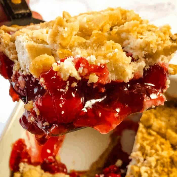 With a base of graham crackers, a cherry pie filling, a vanilla and vegan cream cheese mixture, and a sprinkle of cake mix, this dessert is as simple to prepare as it is delicious to eat