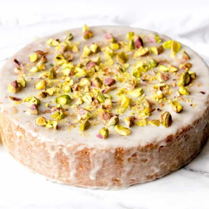 Olive oil, pistachio oil, applesauce, and lemon zest add moisture and complexity to the cake, while the lemon-and-pistachio glaze offers lemony sweetness with a slight nutty crunch. 