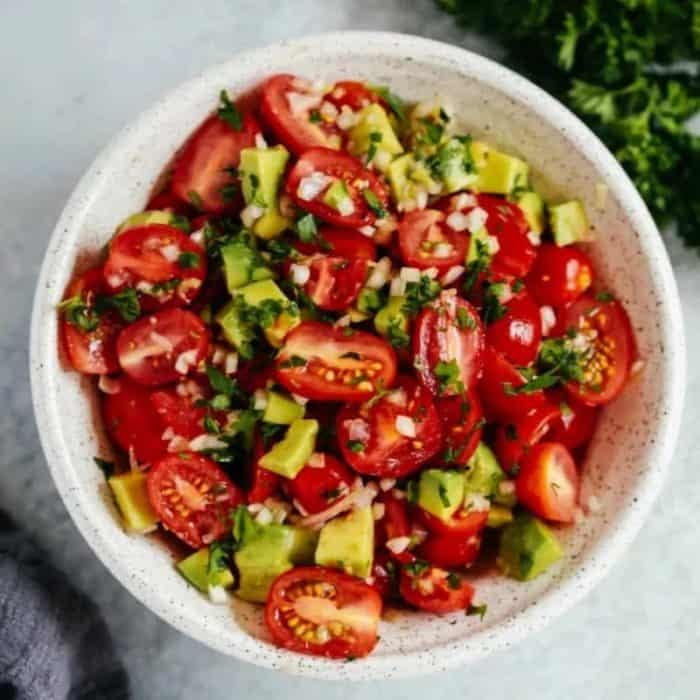 Savor the simplicity and freshness of this avocado tomato salad, where creamy avocados and juicy tomatoes come together for a heart-healthy vegan treat.