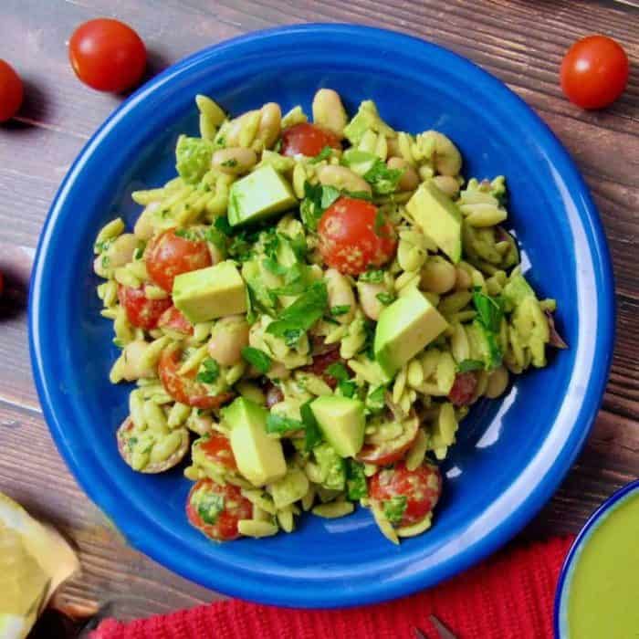 Tender orzo pasta is combined with crisp veggies like cucumbers, cherry tomatoes, red onions, and bell peppers in this dish!