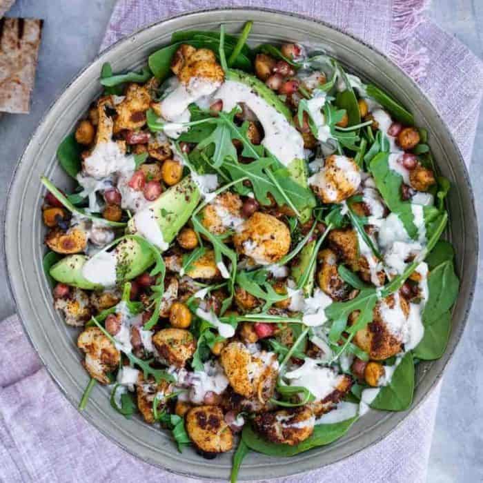 Roasted cauliflower takes center stage in this salad, with a mix of spices and seasonings like za'atar, cumin, and paprika that deliver a tempting depth of flavor.