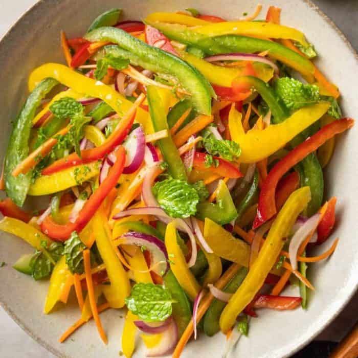 Carrots, red onions, and mint leaves offer a contrast to the bell pepper’s sweetness and bring a flavorful crunch to your dining experience.