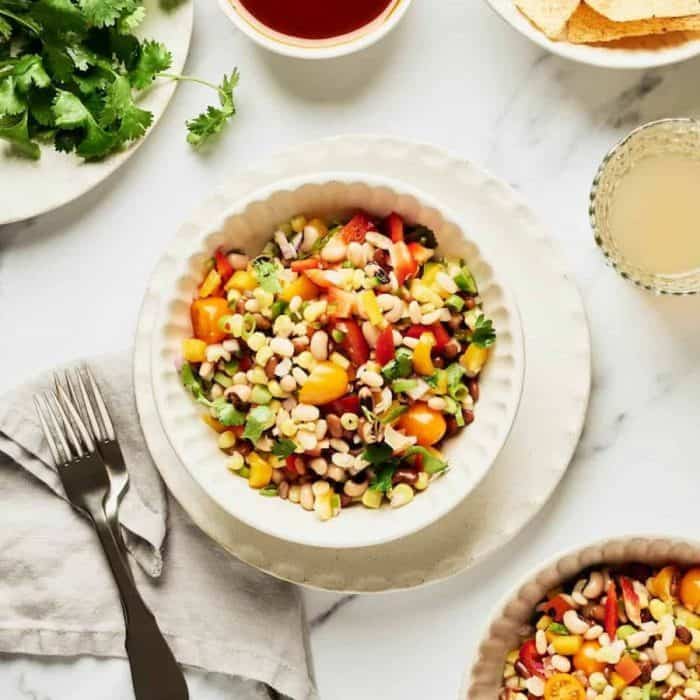 This salad is a celebration of the rich tapestry of Native American cuisine, featuring the hearty texture of tepary beans, a staple among the Tohono O'odham and Akimel O'odham peoples.