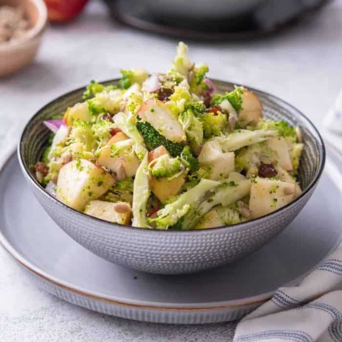 Sweet and savory meld together perfectly in this vegan salad recipe, which brings the crispness of fresh apples and the hearty crunch of broccoli to the forefront with a dressing of olive oil, apple cider vinegar, maple syrup, and garlic.