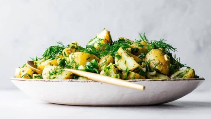 Rustic and comforting, this potato salad gives you all the familiar flavors of the classic recipe, including fork-tender potatoes and a lively dressing made with Dijon mustard, vegan mayo, preserved lemons, and apple cider vinegar.