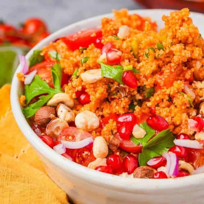 The Turkish kisir is a hearty salad that's a symphony of flavors, featuring the nutty taste of bulgur wheat, the sharpness of scallions and onions, the tang and kick of tomato and pepper pastes, and the depth of pomegranate molasses.