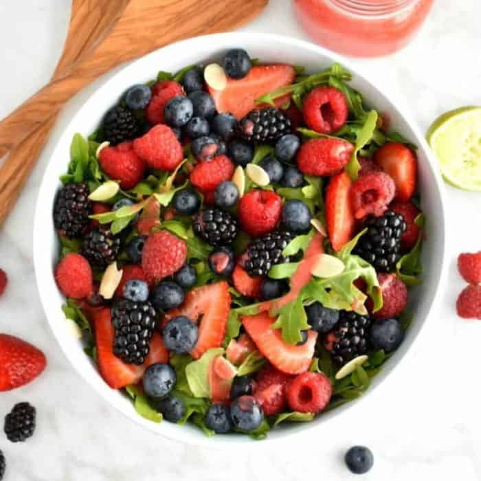 The juicy berries here provide a burst of sweetness, while the arugula adds a dash of sharpness. Topped with crunch almonds, this is a superb option for a lovely snack or a vibrant appetizer.