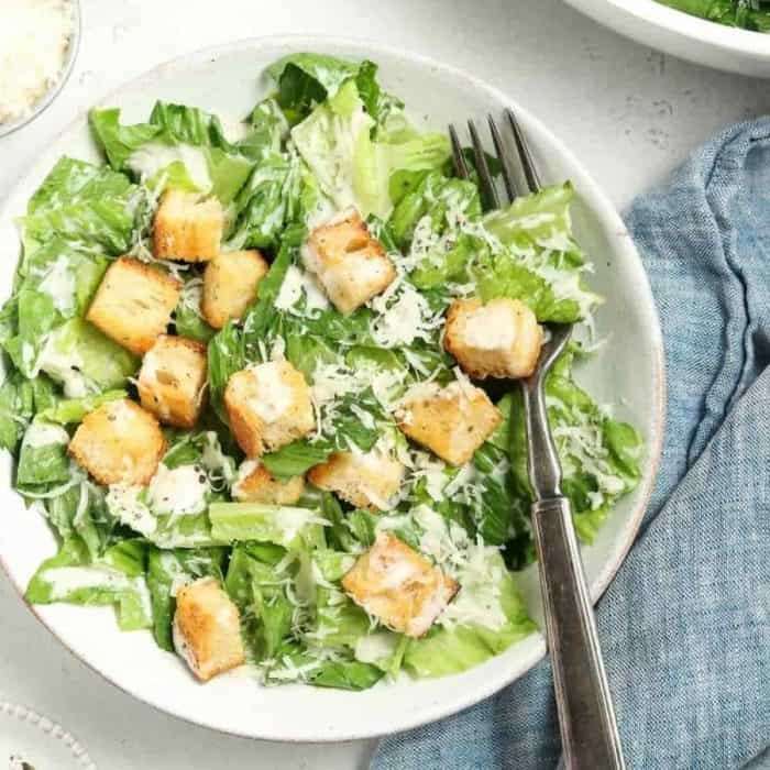 Homemade golden croutons and a dusting of vegan parmesan cap off the salad and make it an amazing indulgence for any occasion.