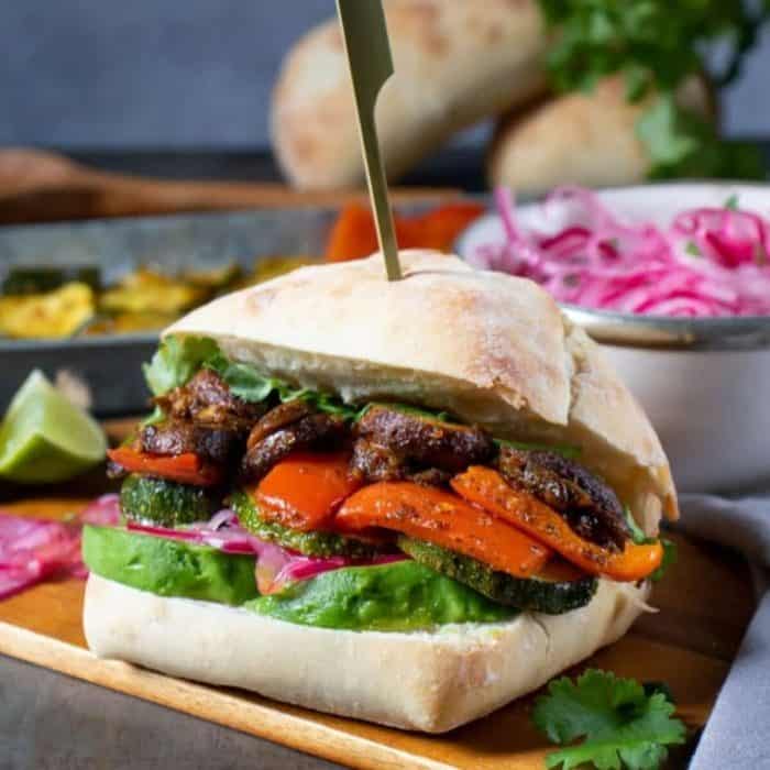 a photo of peruvian vegan burger sandwich with toothpick on top