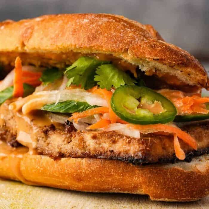 a close up photo of vegan banh mi sandwich