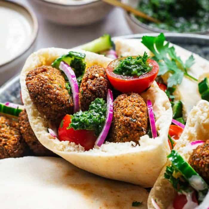 a close up photo of falafel pita sandwich