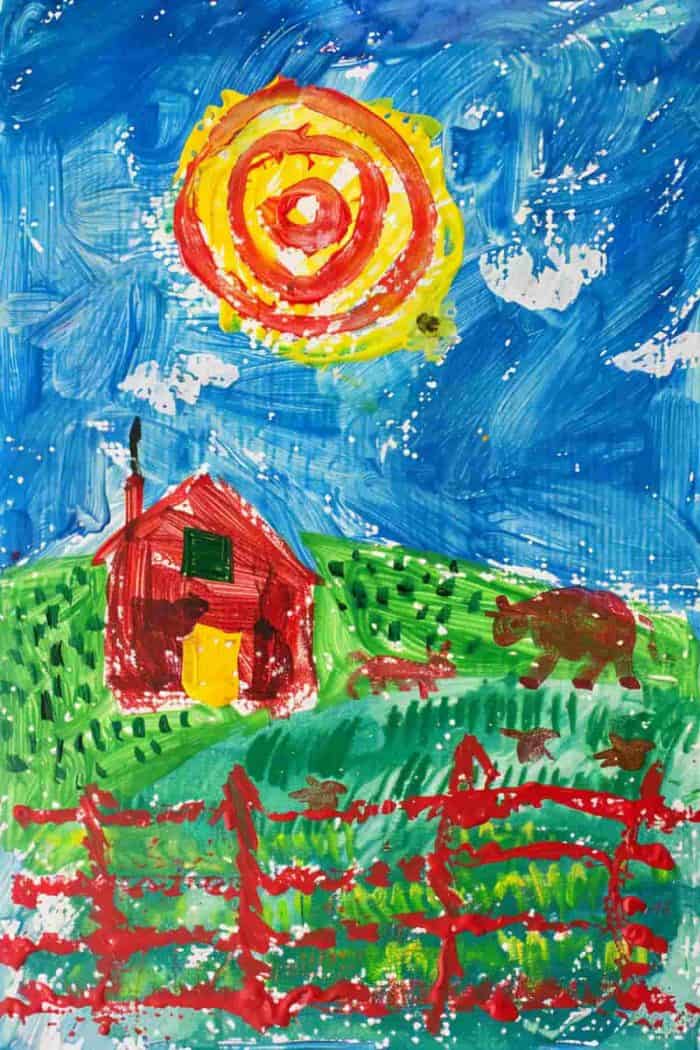 A finger painting of a charming farm scene with a red barn and a cow in a field against a blue sky