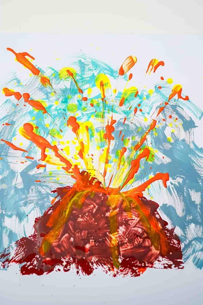 A finger painting of a fiery volcano eruption