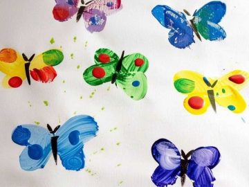 Help your child press their thumbs onto paper to create the fluttering wings of butterflies, adding tiny drops of paint with a brush to make each one unique.