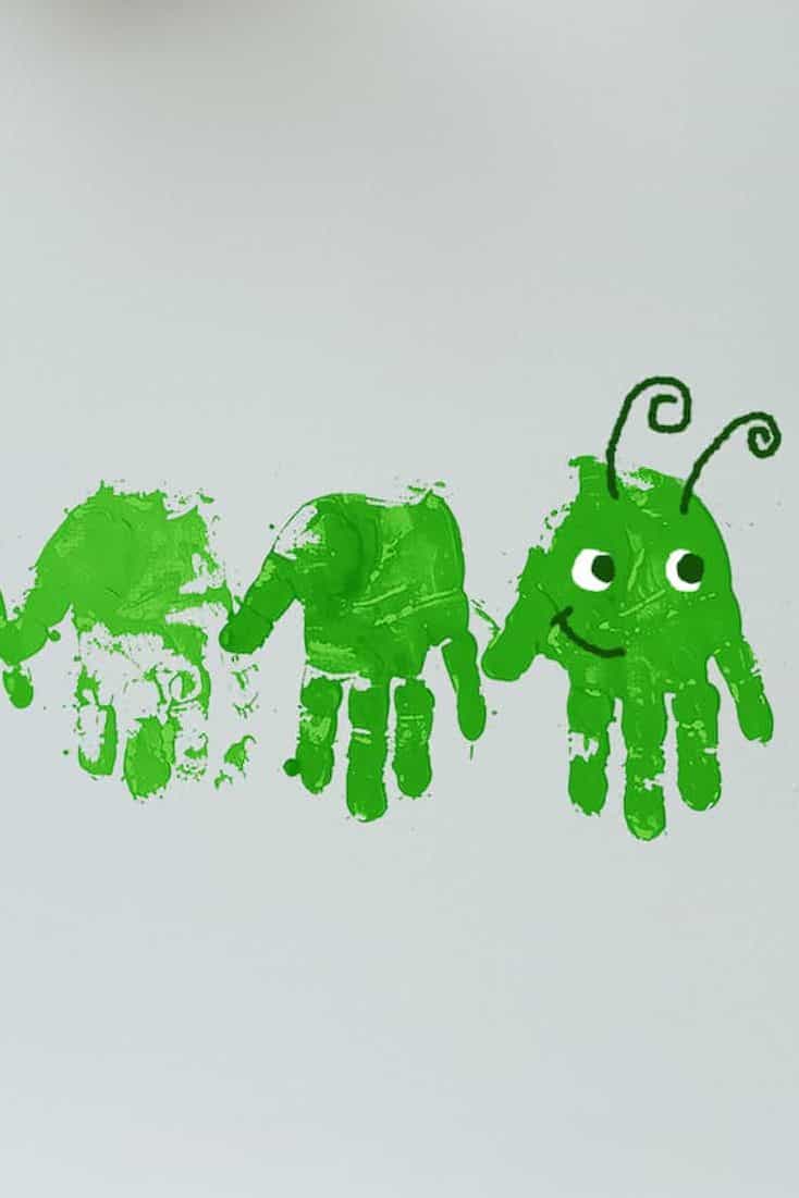 Form a caterpillar by connecting a series of green handprints in a line.   To give the caterpillar character, add handprint details like antennae and a smiling face to the lead print.