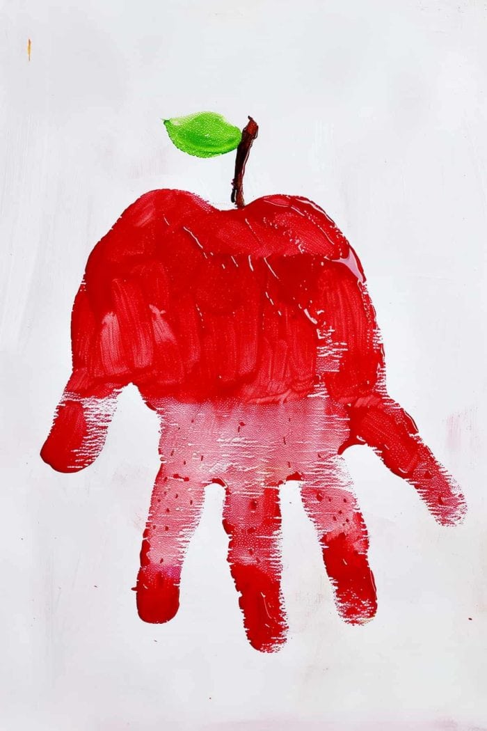 Your child can use a red handprint to create a juicy red apple. Then they can use a brush to paint a stem and a leaf. This can encourage them to develop their creative skills and even make eating healthy fruits more exciting.