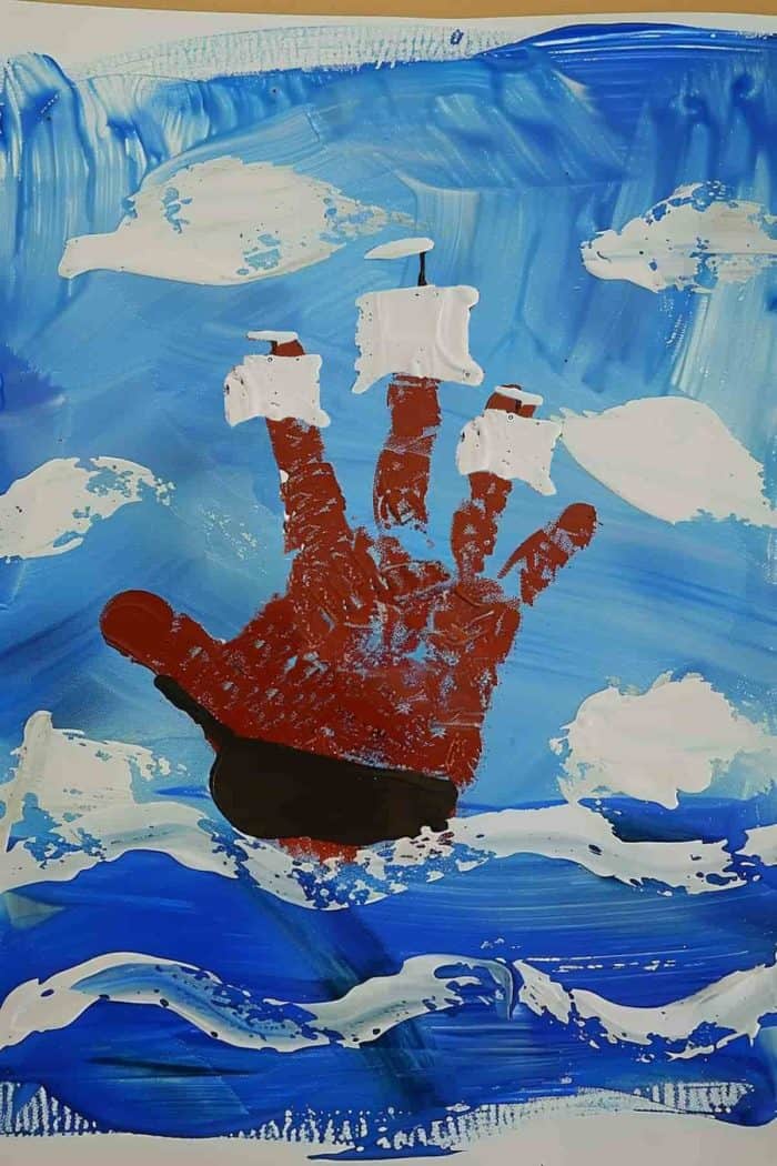 Craft a pirate ship with a handprint hull and fingers as the masts. Paint the hand brown or black for the ship's body and add white or striped sails, then set it atop wavy blue lines to represent the sea for a swashbuckling adventure.