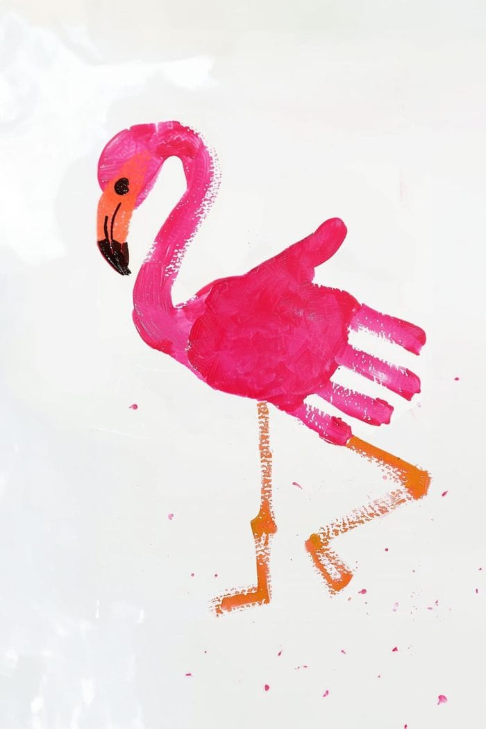 Create a charming pink flamingo handprint painting by painting your child's hand with pink paint and pressing it onto paper to form the flamingo's body and neck. Help them add details like legs, an eye, and a beak.