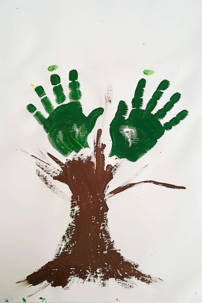 Design a tree using two handprints for leaves, both in green. Your child can then use their fingers to paint the trunk and branches or even add a few flowers. 