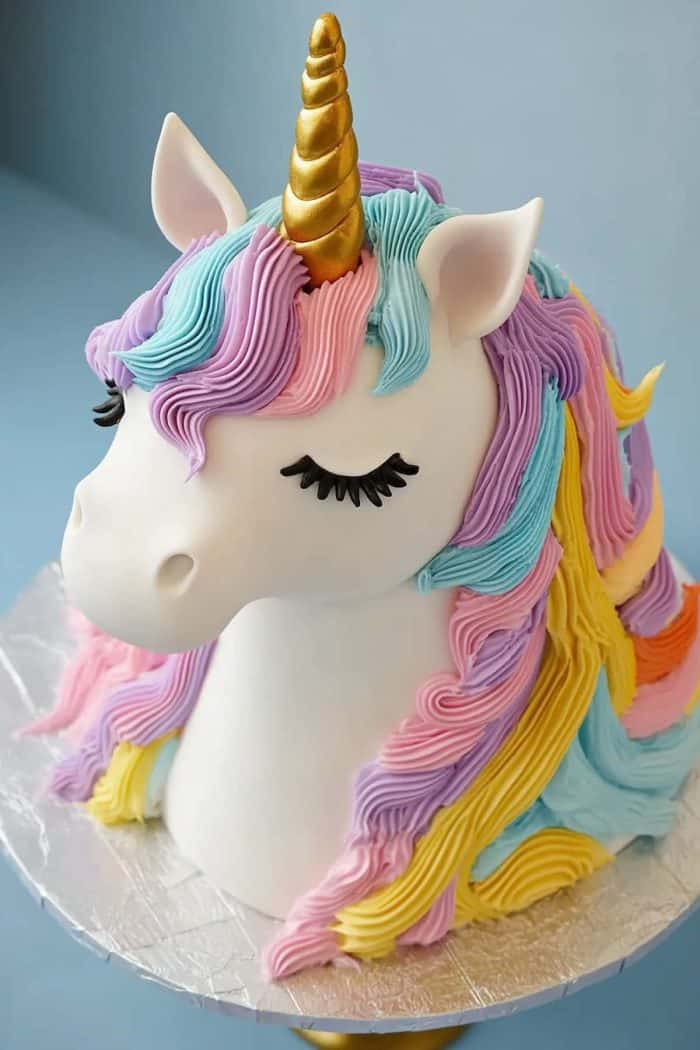 Bring a touch of magic to your event with a sculpted rainbow unicorn cake! Shape your cake into the form of a unicorn head, and use vibrant rainbow colors for the mane. Add a golden horn made from fondant.