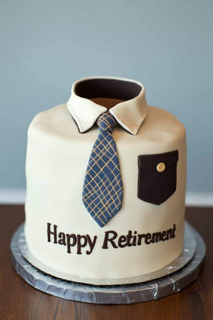 A sophisticated retirement cake designed for a white-collar worker, featuring a collar and tie theme. The base is a classic vanilla cake layered with rich chocolate ganache, covered in smooth white fondant. A fondant shirt collar and a neatly tied fondant tie in the retiree's favorite color adorn the cake, with the text 'Happy Retirement' in elegant script below the tie. Small fondant buttons and a pocket on the shirt add a finishing touch, making it look like a perfectly pressed dress shirt.