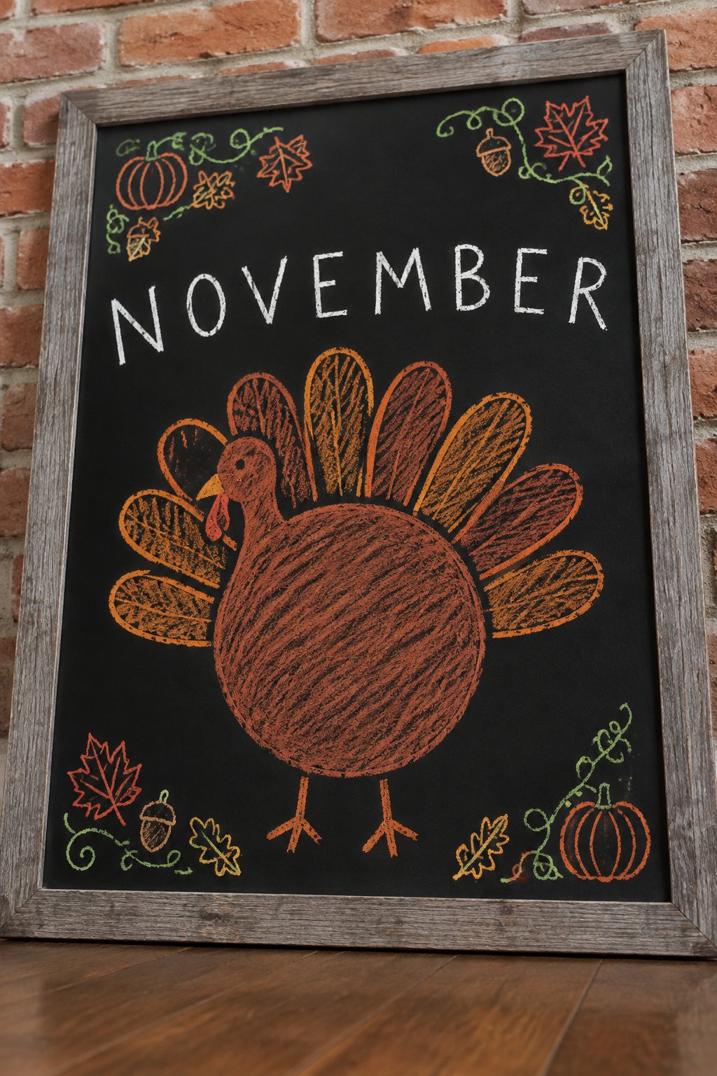 Round Turkey Doodle: a framed fall chalkboard sign reading "November", hand-drawn in chalk with one large round turkey body with a simple fan tail, bigger than the word.